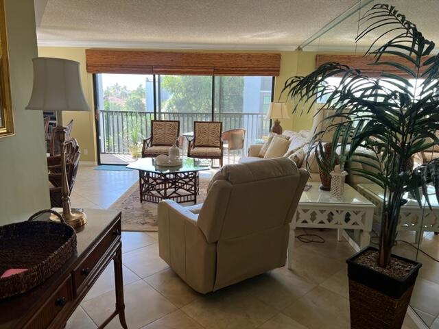 1605 Highway 1, Unit A301 Jupiter, FL 33477 - Photo 2 of 35 a living room with furniture and a floor to ceiling window