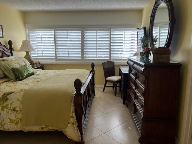 1605 Highway 1, Unit A301 Jupiter, FL 33477 - Photo 28 of 35 a bedroom with furniture and a window