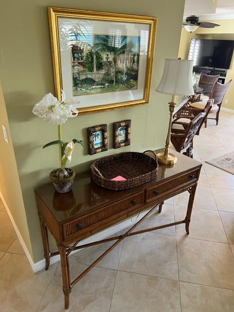 1605 Highway 1, Unit A301 Jupiter, FL 33477 - Photo 3 of 35 a living room with a couch and a potted plant