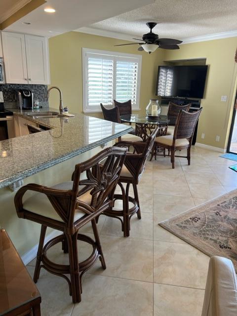 1605 Highway 1, Unit A301 Jupiter, FL 33477 - Photo 7 of 35 a dining room with furniture and window