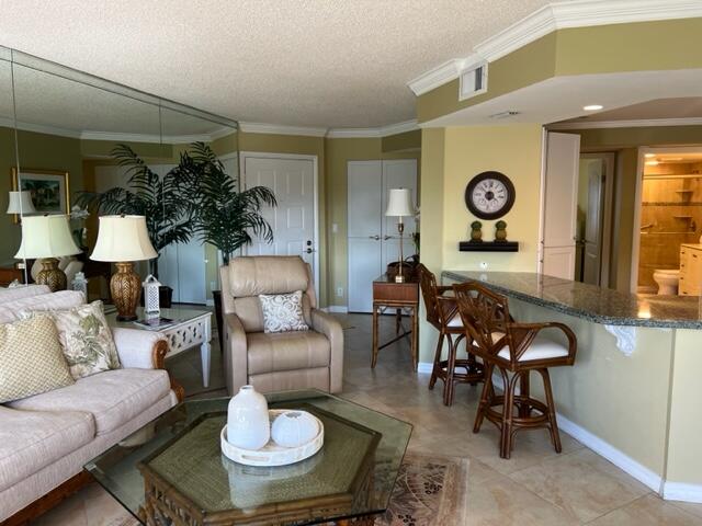 1605 Highway 1, Unit A301 Jupiter, FL 33477 - Photo 9 of 35 a living room with furniture and a large window