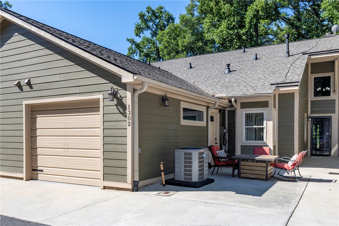 1302 Leeward Road Anderson, SC 29625 - Photo 1 of 50 A well-maintained facade with modern siding and an inviting outdoor patio space.