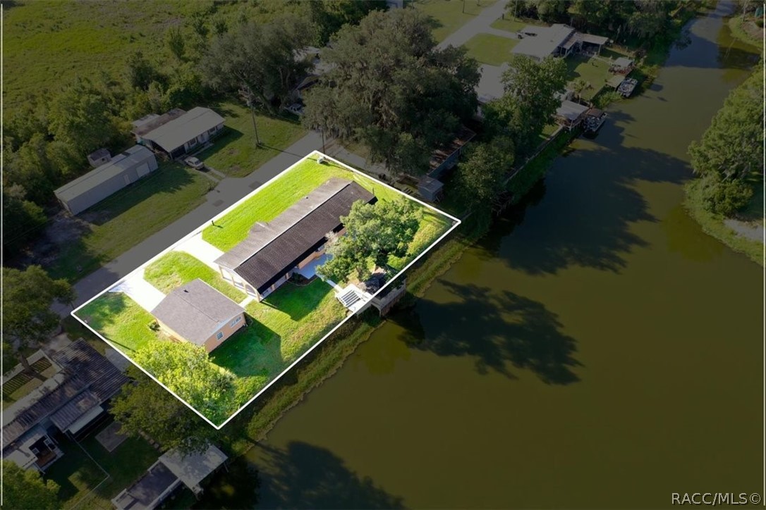 928 South Shad Terrace Inverness, FL 34450 - Photo 40 of 48 an aerial view of a house with pool yard lake and outdoor seating