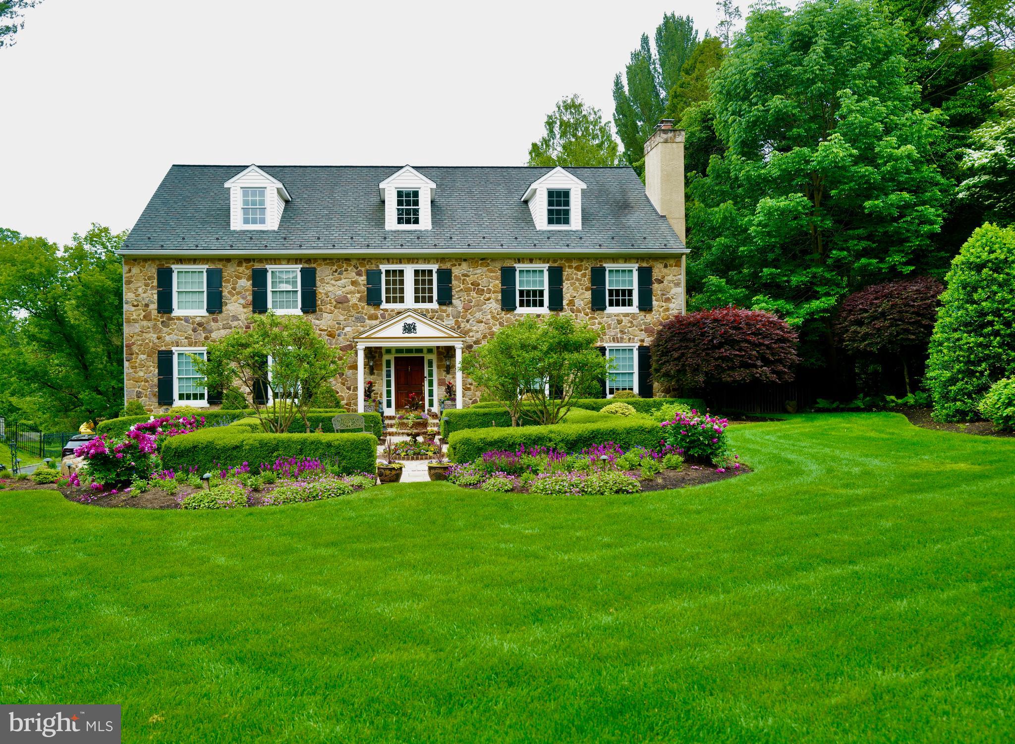 a front view of a house with a yard table and chairs