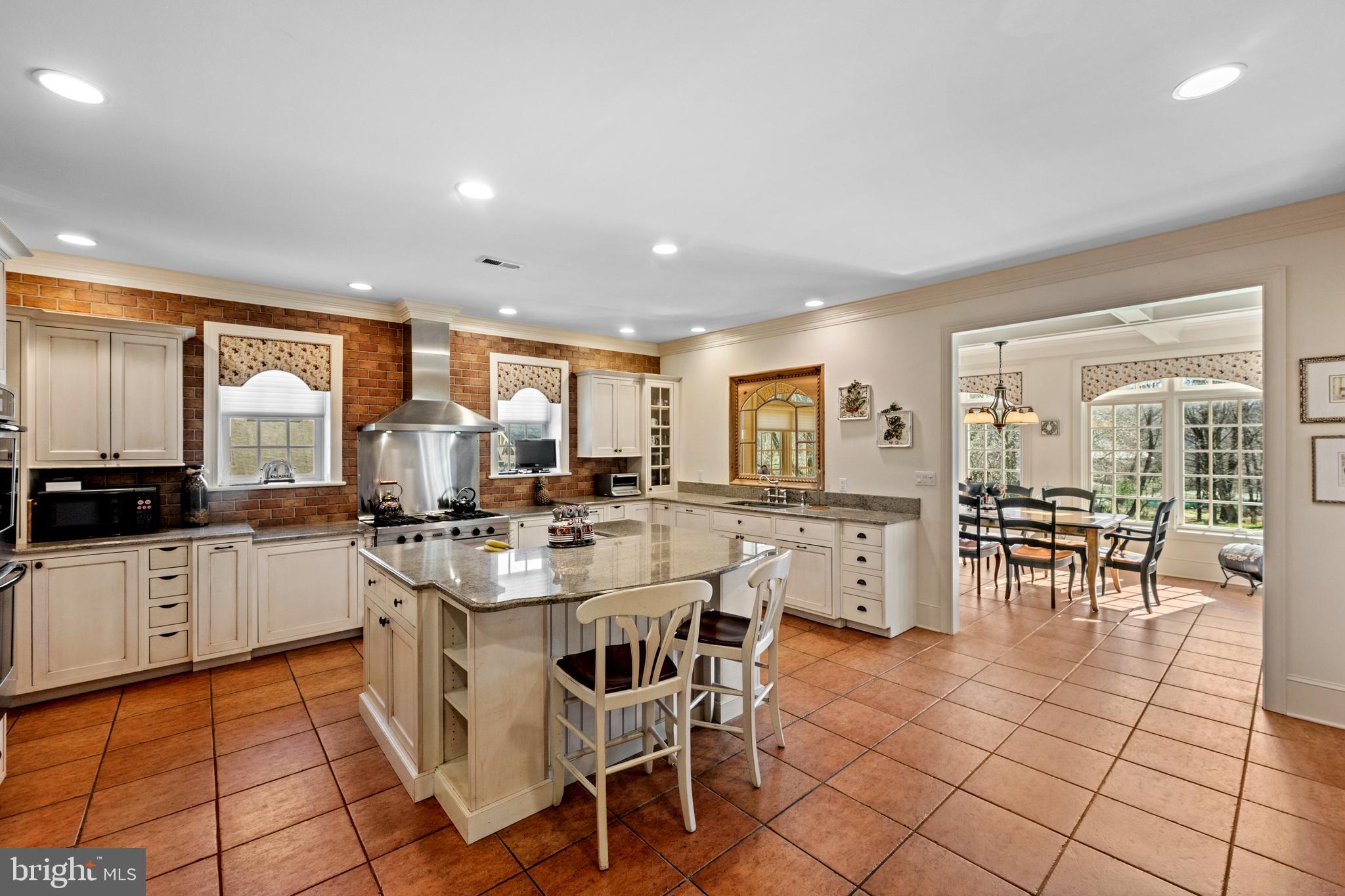 825 Hagys Ford Road Penn Valley, PA 19072 - Photo 11 of 45 a large kitchen with a table and chairs