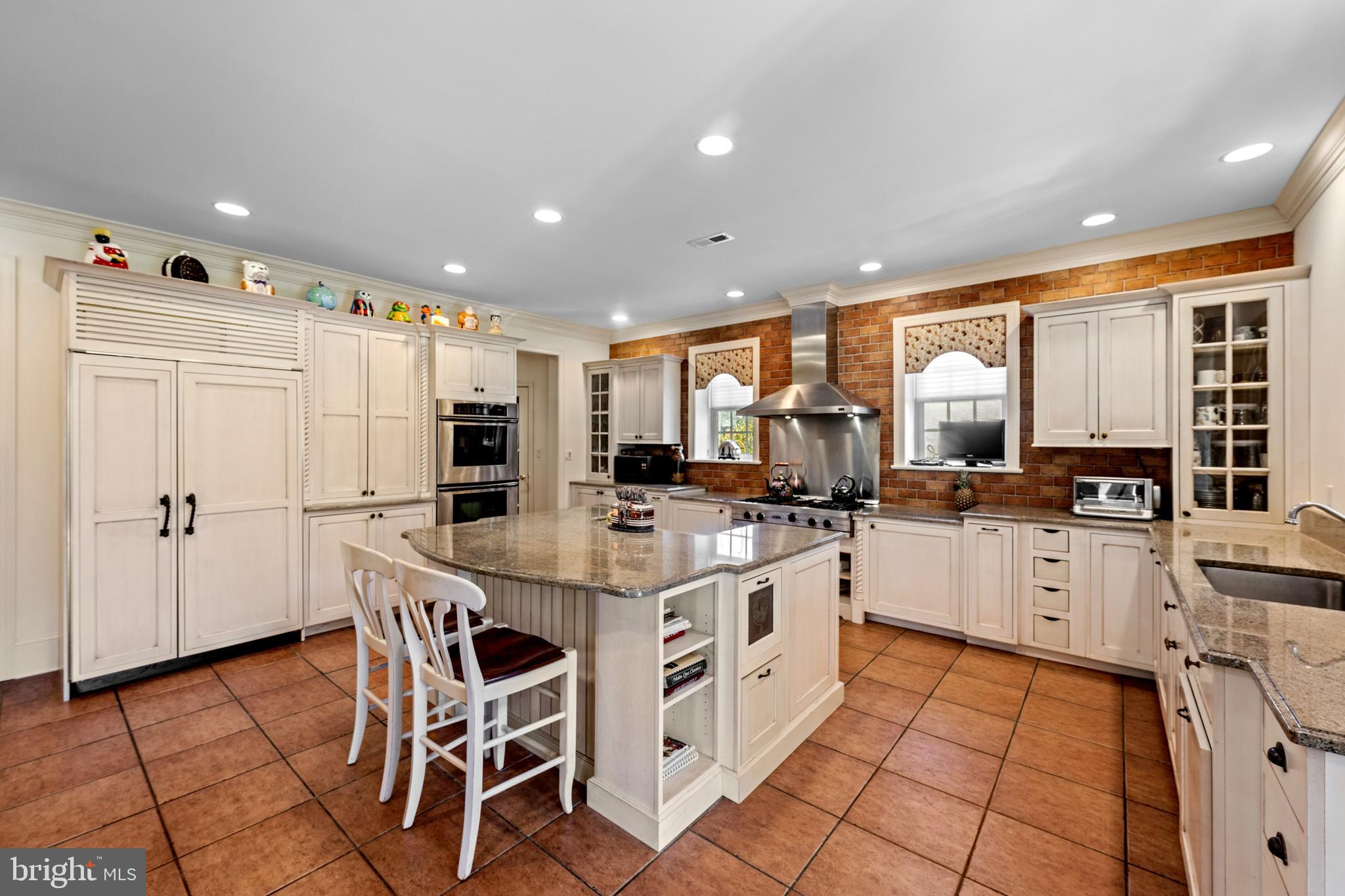 825 Hagys Ford Road Penn Valley, PA 19072 - Photo 15 of 45 a kitchen with a sink a counter top space stainless steel appliances and cabinets