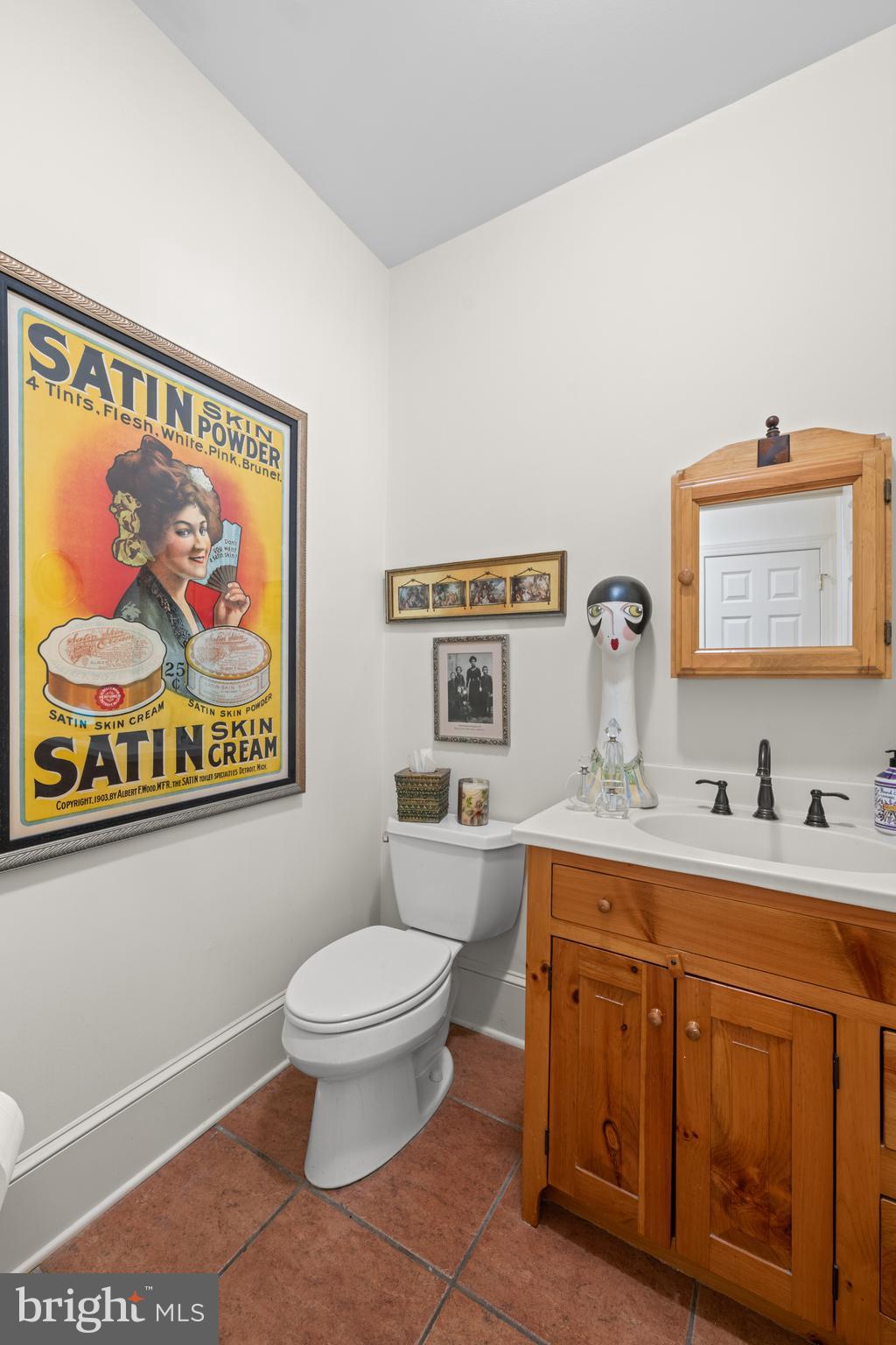 825 Hagys Ford Road Penn Valley, PA 19072 - Photo 17 of 45 a spacious bathroom with a toilet a sink and a mirror