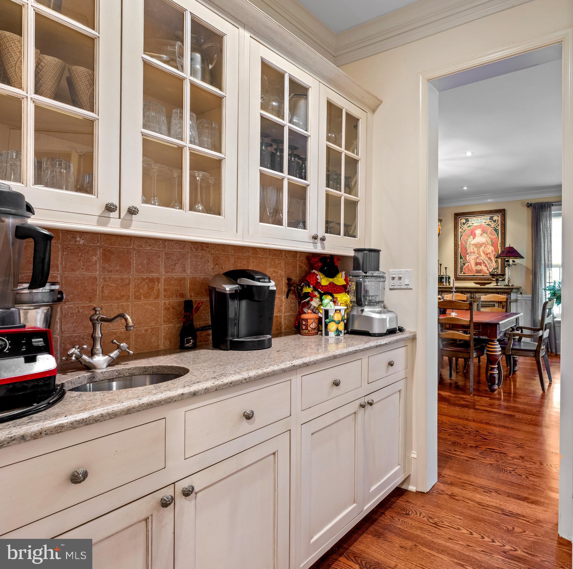 825 Hagys Ford Road Penn Valley, PA 19072 - Photo 19 of 45 a kitchen with granite countertop cabinets and wooden floor