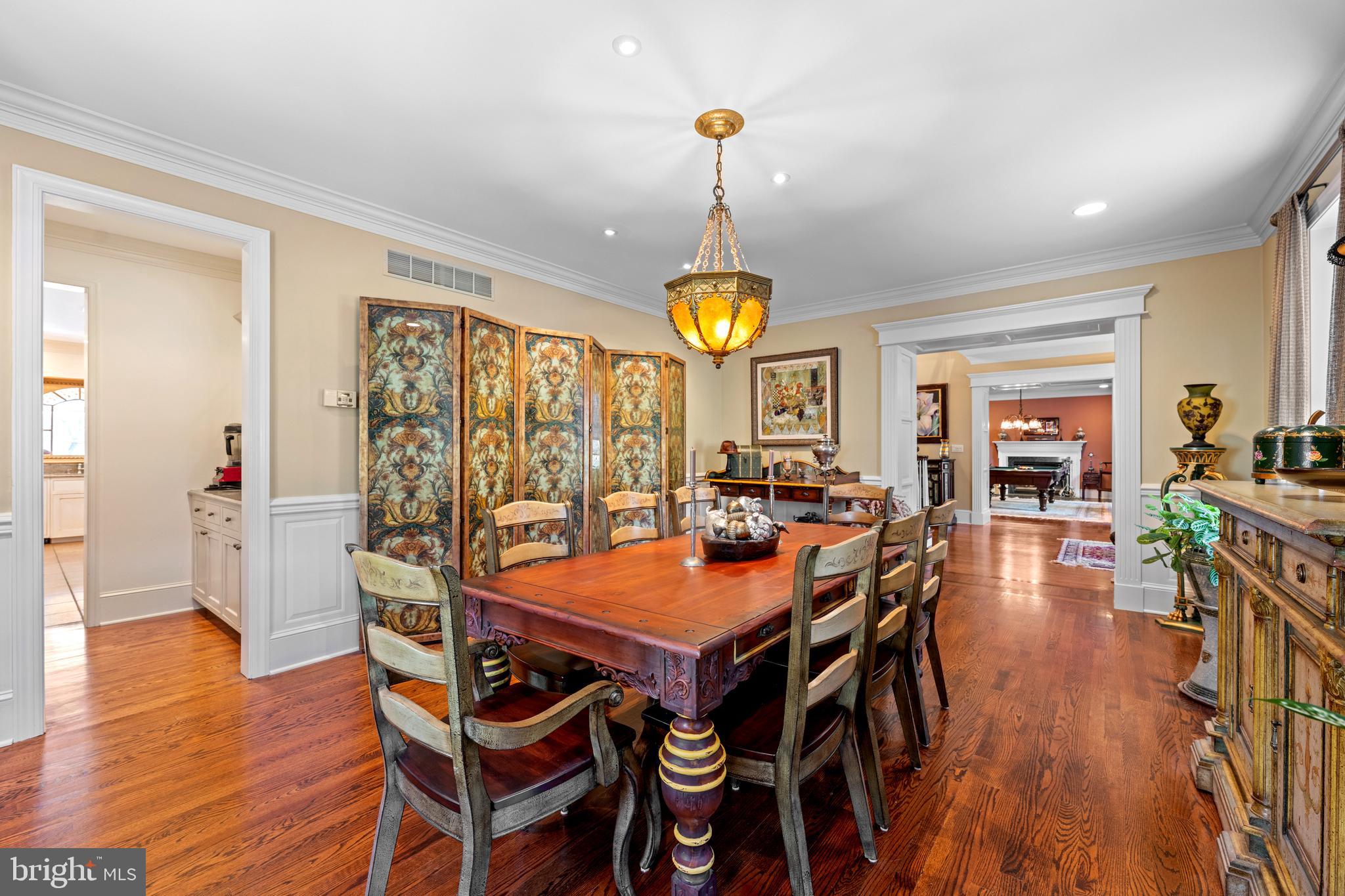 825 Hagys Ford Road Penn Valley, PA 19072 - Photo 20 of 45 a view of a dining room and livingroom with furniture wooden floor a chandelier