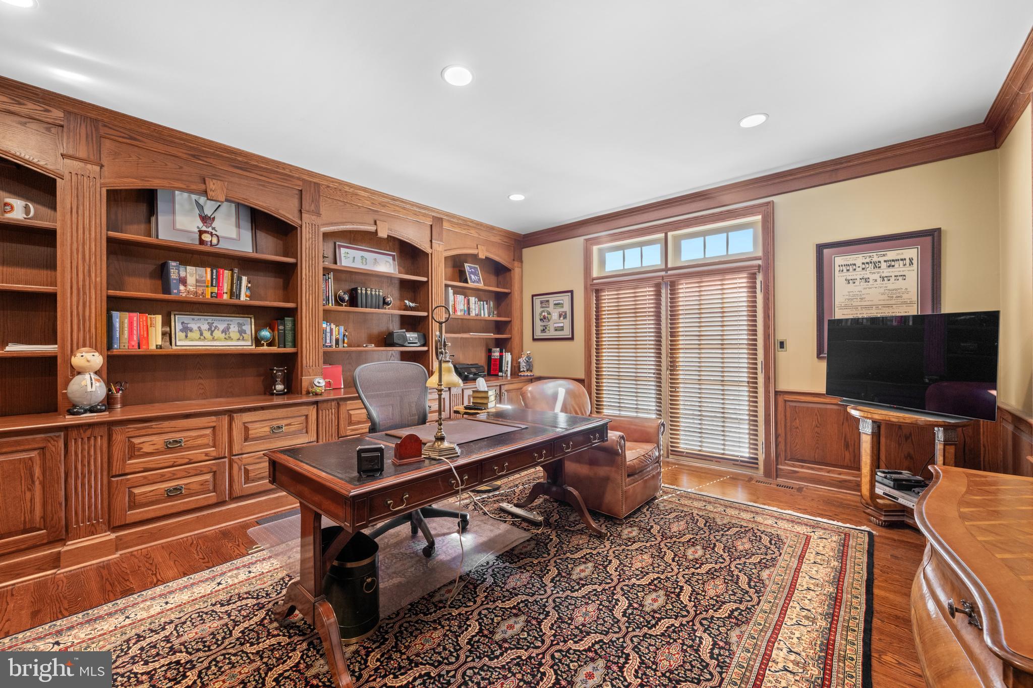 825 Hagys Ford Road Penn Valley, PA 19072 - Photo 27 of 45 a living room with furniture and a flat screen tv