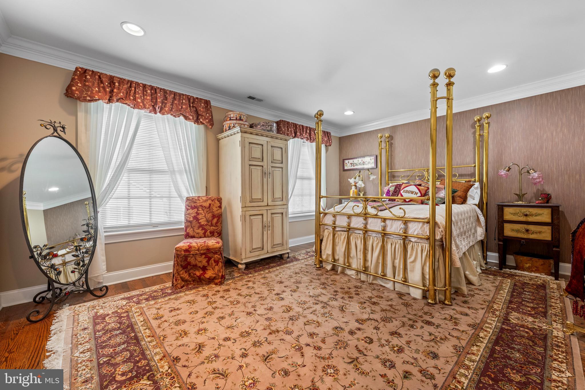 825 Hagys Ford Road Penn Valley, PA 19072 - Photo 39 of 45 a very nice looking bedroom with a large window and chandelier