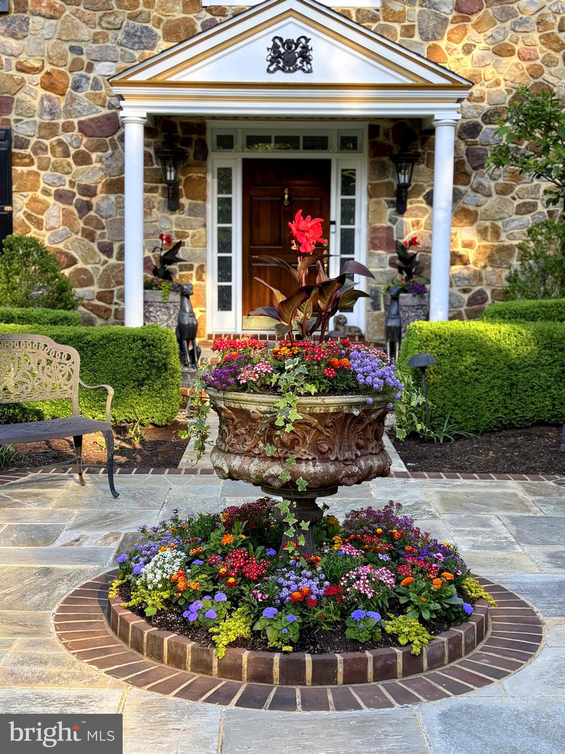 825 Hagys Ford Road Penn Valley, PA 19072 - Photo 4 of 45 a front view of a house with a yard and fountain