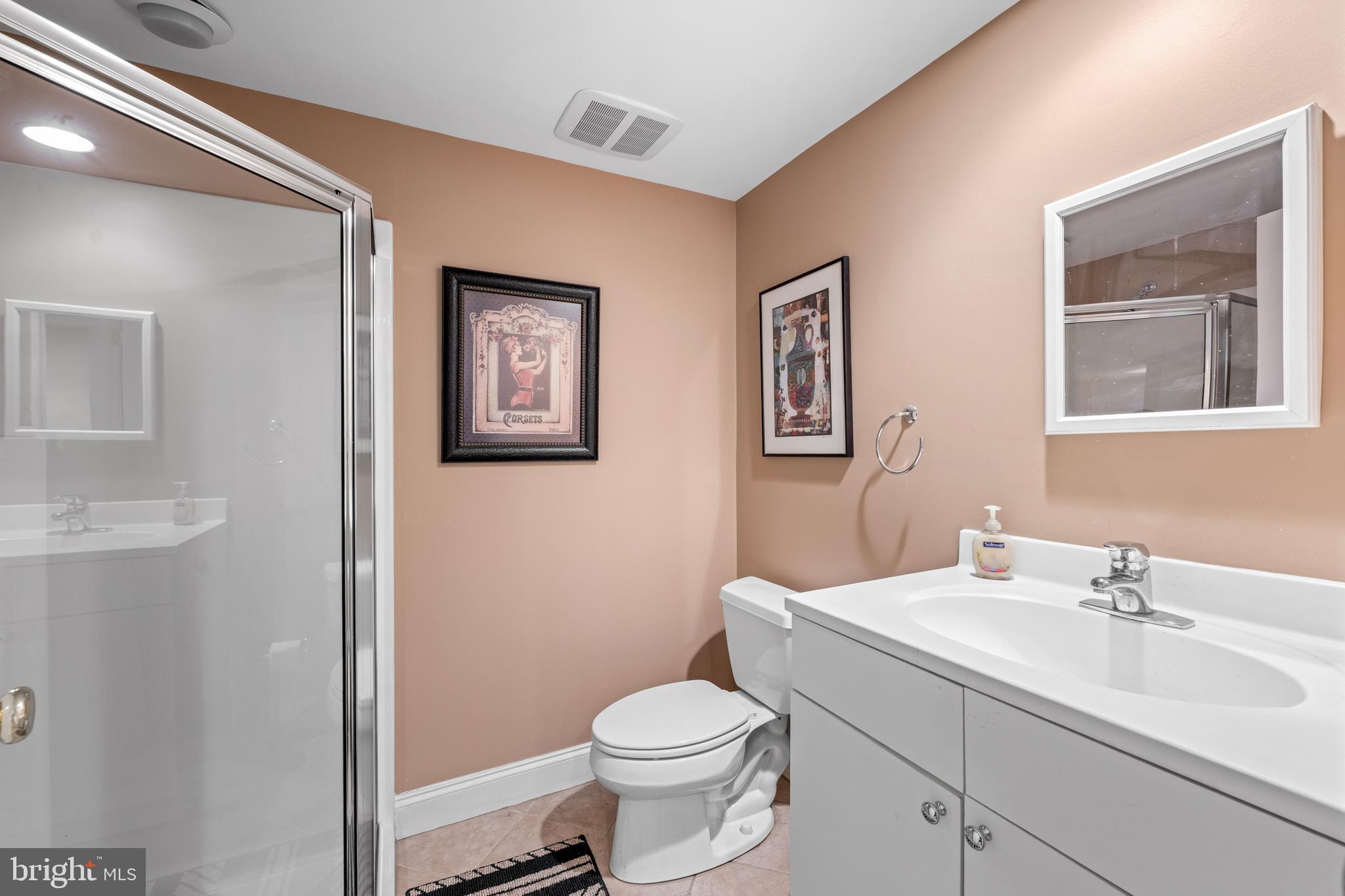 825 Hagys Ford Road Penn Valley, PA 19072 - Photo 45 of 45 a bathroom with a toilet sink and mirror