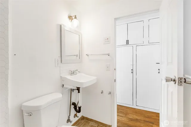 a view of a room with wooden floor and window