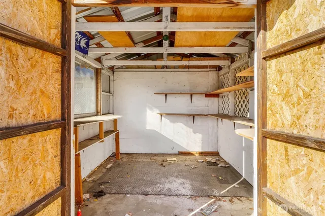 a view of a door and wooden floor