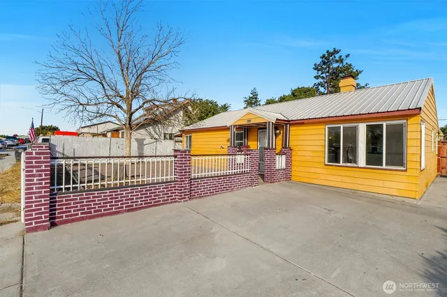 a view of a house with a iron gate