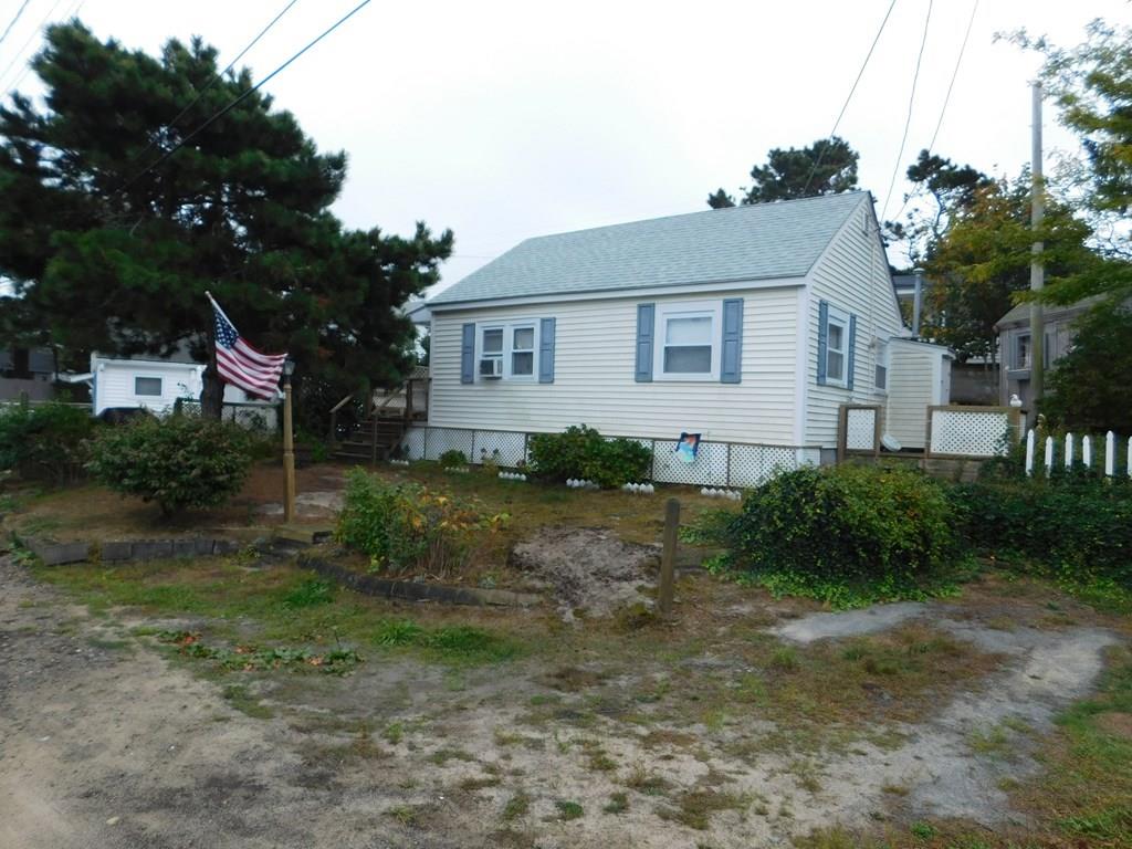 218 Old Wharf Road, Unit 218 Dennis, MA 02639 - Photo 1 of 32 a view of a house with a yard