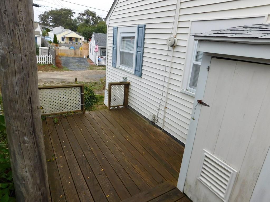 218 Old Wharf Road, Unit 218 Dennis, MA 02639 - Photo 11 of 32 a balcony with a bench
