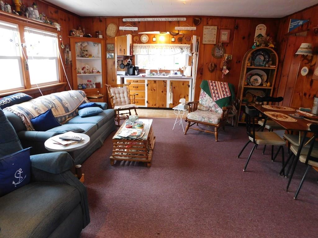 218 Old Wharf Road, Unit 218 Dennis, MA 02639 - Photo 15 of 32 a living room with furniture and a large window
