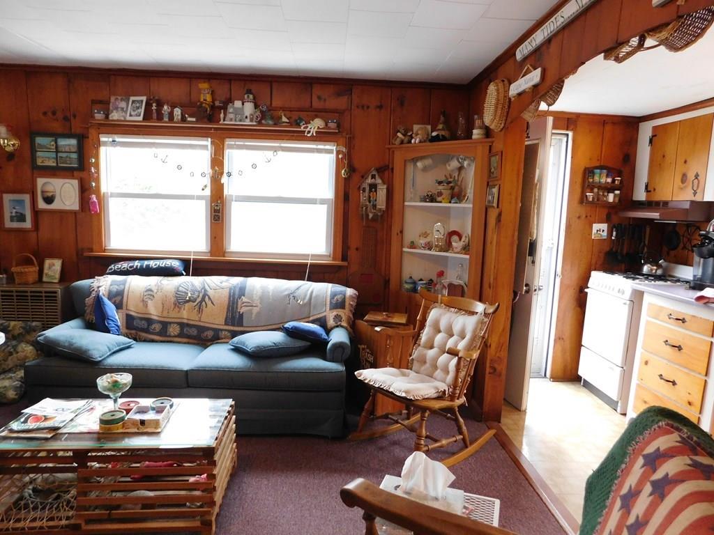 218 Old Wharf Road, Unit 218 Dennis, MA 02639 - Photo 22 of 32 a living room with furniture and a window