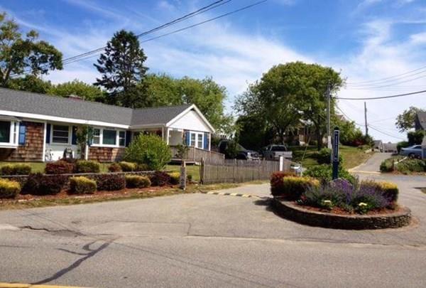 218 Old Wharf Road, Unit 218 Dennis, MA 02639 - Photo 30 of 32 a view of a house with backyard and sitting area