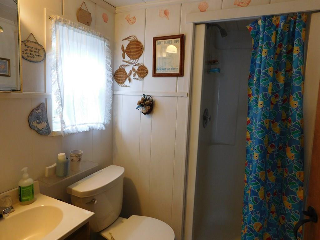 218 Old Wharf Road, Unit 218 Dennis, MA 02639 - Photo 31 of 32 a bathroom with a toilet and shower