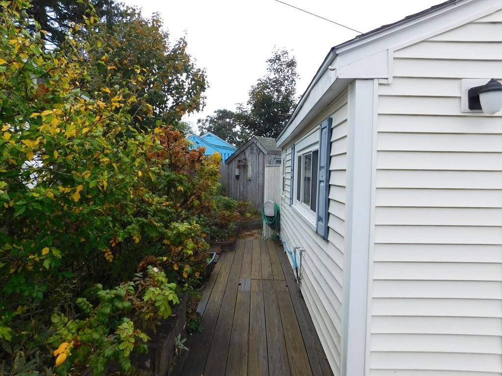 218 Old Wharf Road, Unit 218 Dennis, MA 02639 - Photo 5 of 32 a view of a house with a backyard