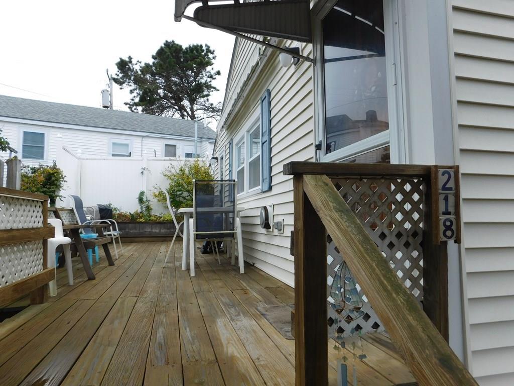 218 Old Wharf Road, Unit 218 Dennis, MA 02639 - Photo 6 of 32 a view of deck with patio