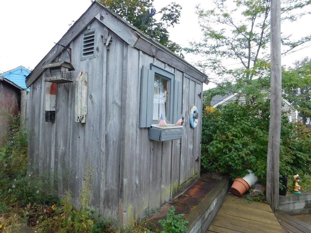 218 Old Wharf Road, Unit 218 Dennis, MA 02639 - Photo 9 of 32 a view of a small house with backyard