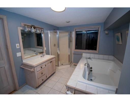 182 Judd Road Otis, MA 01253 - Photo 11 of 26 a bathroom with a sink double vanity mirror and tub