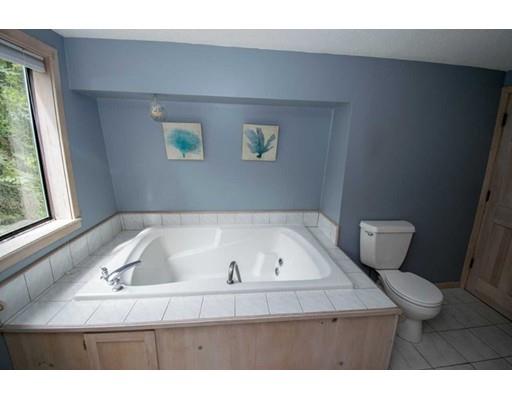 182 Judd Road Otis, MA 01253 - Photo 13 of 26 a bathroom with a bathtub and a window
