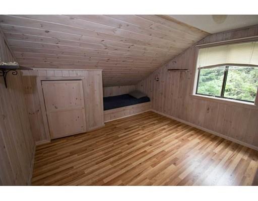 182 Judd Road Otis, MA 01253 - Photo 15 of 26 a view of an empty room with wooden floor and a window