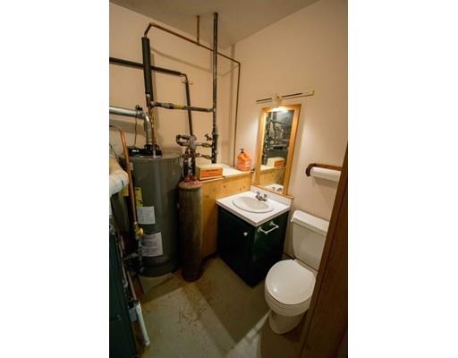182 Judd Road Otis, MA 01253 - Photo 18 of 26 a bathroom with a toilet sink and mirror
