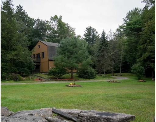 182 Judd Road Otis, MA 01253 - Photo 25 of 26 a front view of a house with a yard