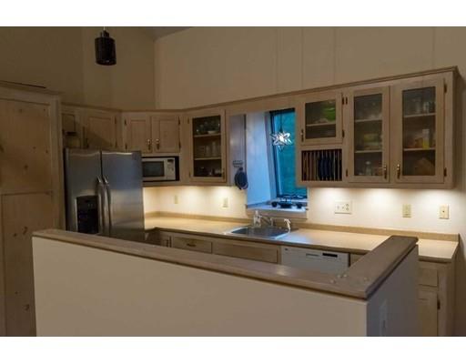 182 Judd Road Otis, MA 01253 - Photo 8 of 26 a kitchen with stainless steel appliances granite countertop a sink and a refrigerator