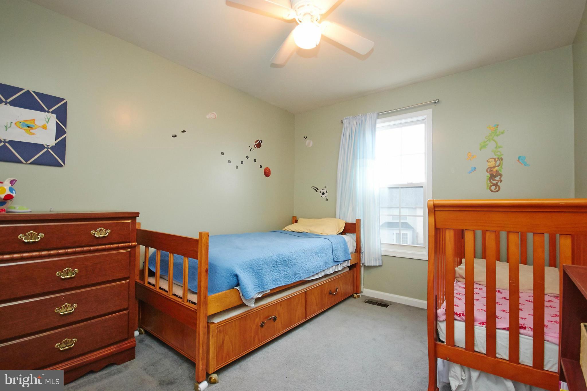 8461 Tackhouse Loop Gainesville, VA 20155 - Photo 19 of 29 a bedroom with a bed and a window