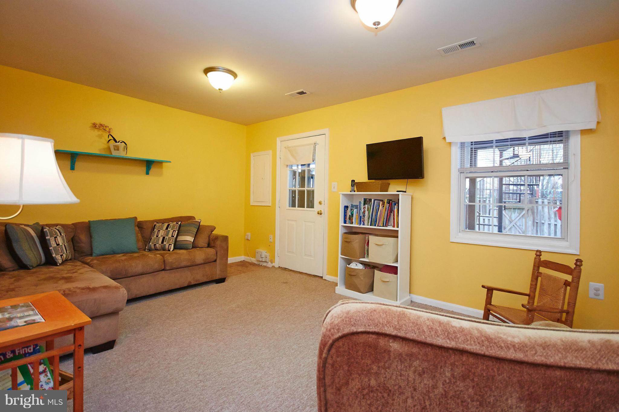 8461 Tackhouse Loop Gainesville, VA 20155 - Photo 22 of 29 a bedroom with a bed and couch
