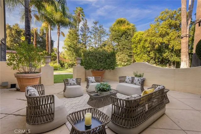 a living room with fireplace furniture and a fireplace