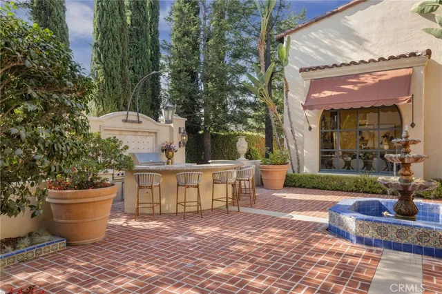 a spacious bedroom with a large bed and a fireplace