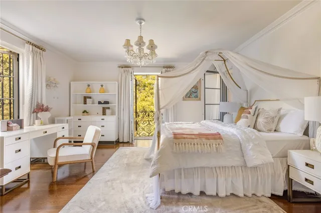 a view of a houses with a yard and potted plants