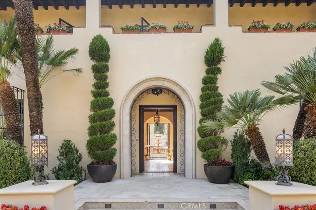 a view of a house with potted plants