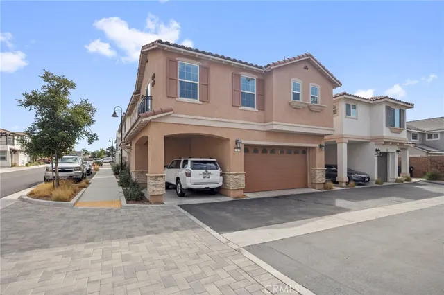 a view of a car park in front of house