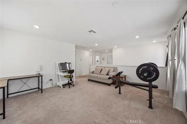 a living room with furniture and a rug