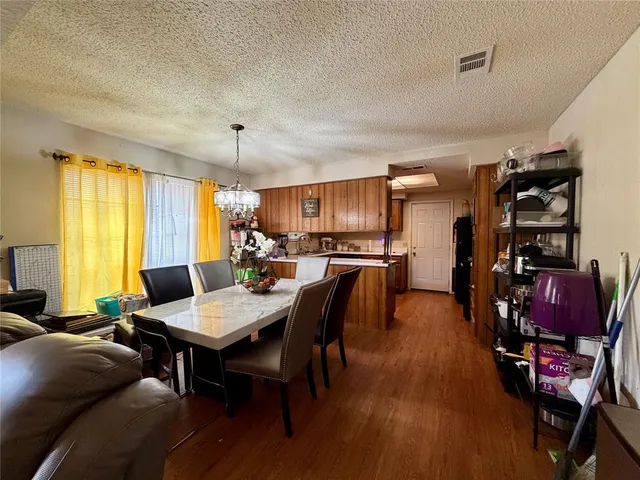 a view of a dining room with furniture and window