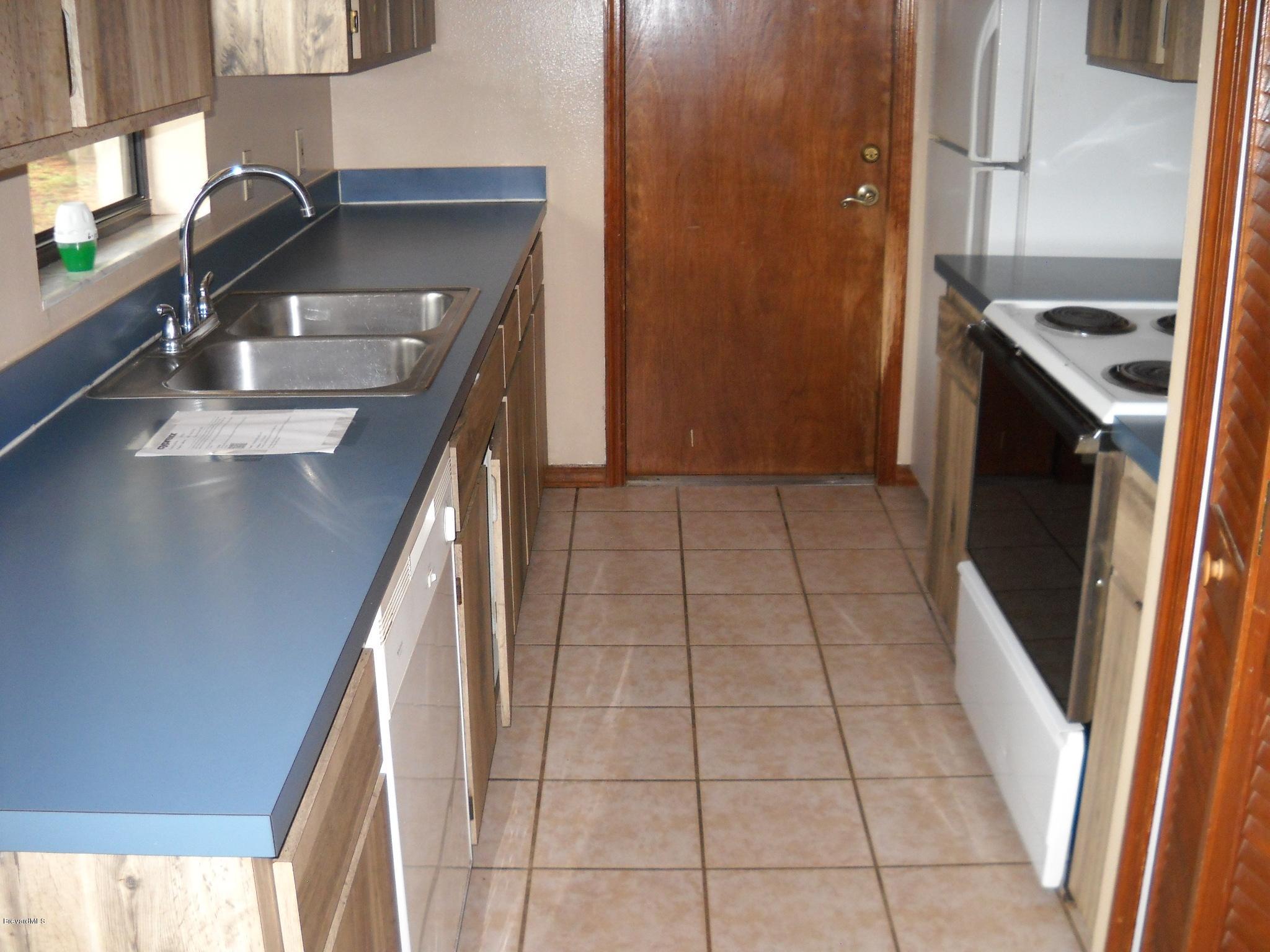 6660 Cecil Road Cocoa, FL 32927 - Photo 3 of 12 Galley Kitchen