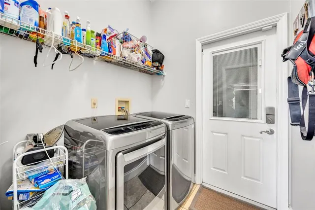 a utility room with dryer and washer