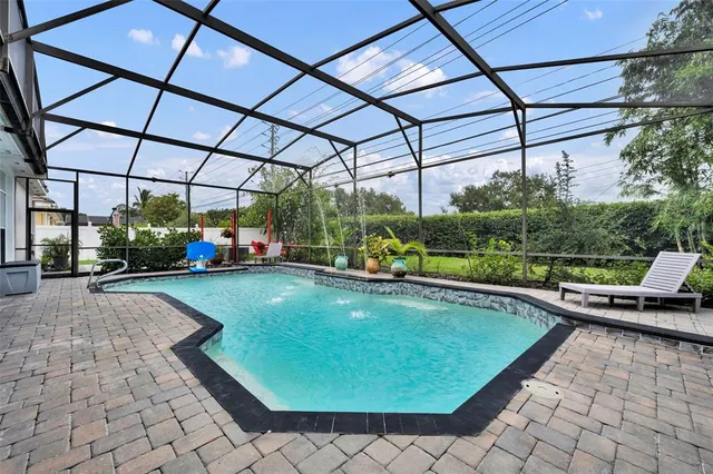 a view of swimming pool with a patio