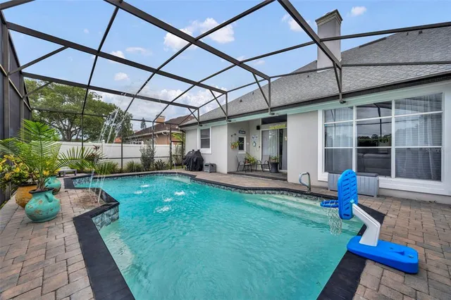 a view of a backyard with sitting area