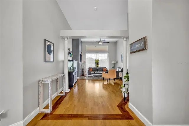 a room with lots of furniture and wooden floor