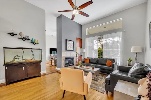 a living room with furniture and a fireplace